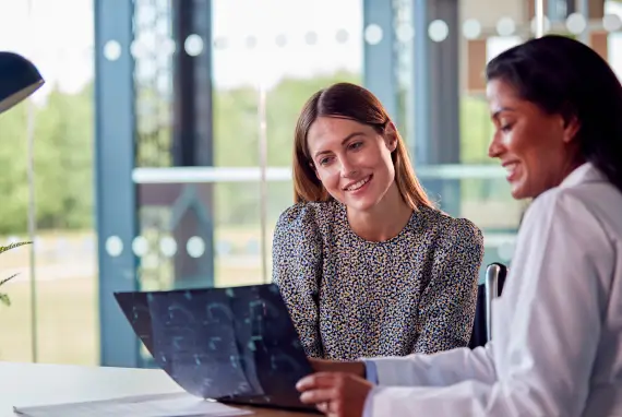 Two professionals discussing ERP solutions in a modern office setting.