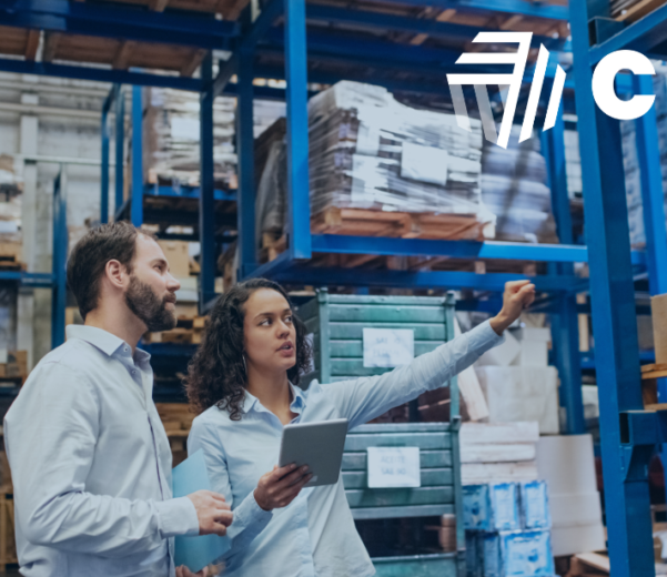 A warehouse worker using Cin7 inventory management system for small businesses, showcasing organized shelves and streamlined operations.